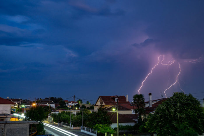 Lightning strike with blue, purple sky.