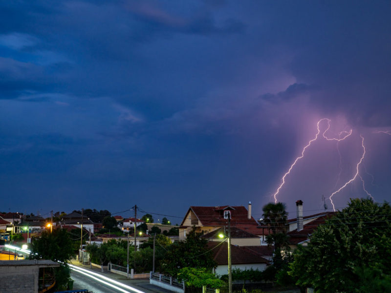 Lightning strike with blue, purple sky.