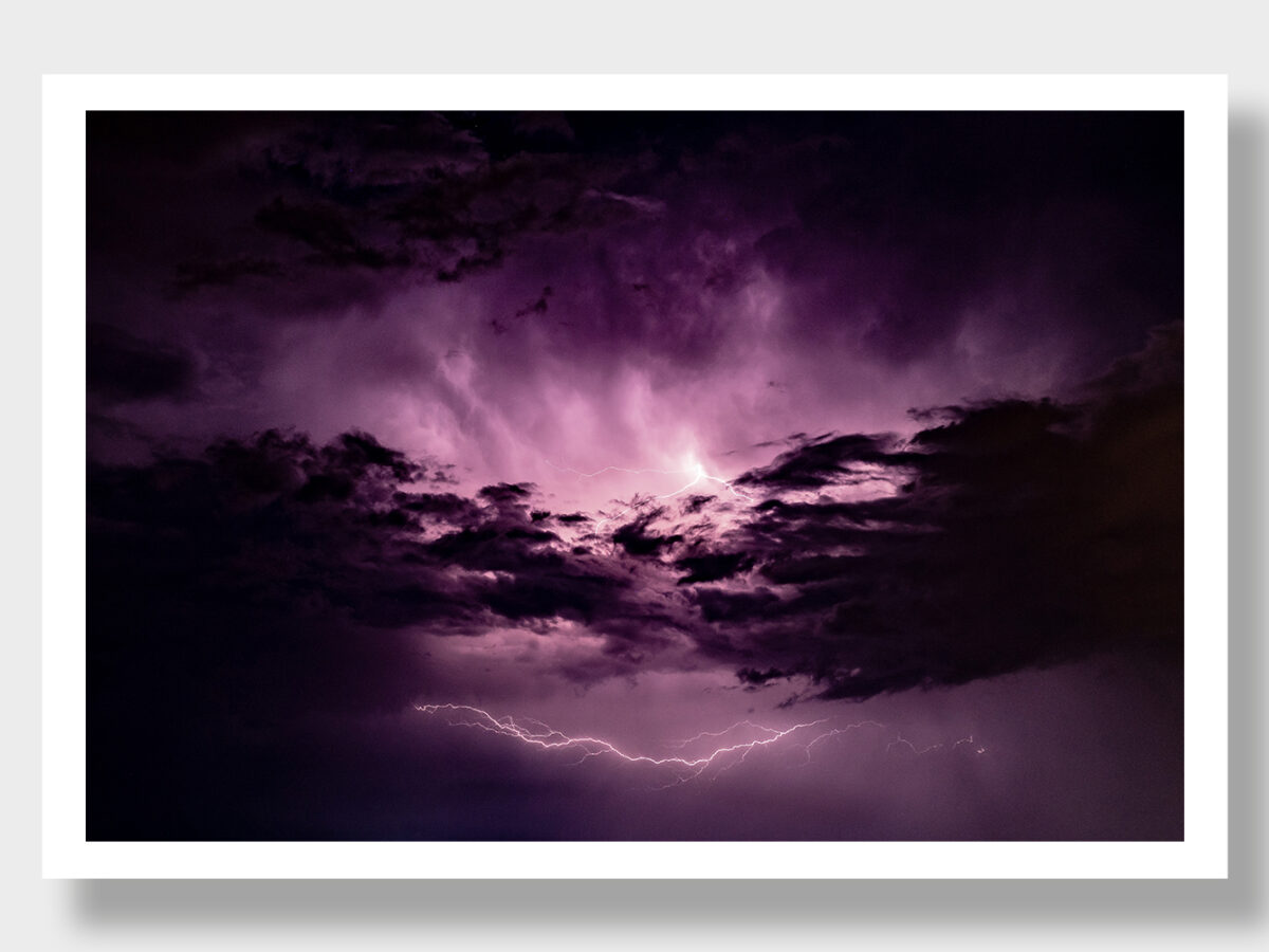 Behold the surreal beauty of a sky painted in shades of violet, alive with the energy of vertical lightning over Greece. This extraordinary image captures the intensity and awe-inspiring nature of a stormy night, offering a glimpse into the power of the elements in the Greek landscape.