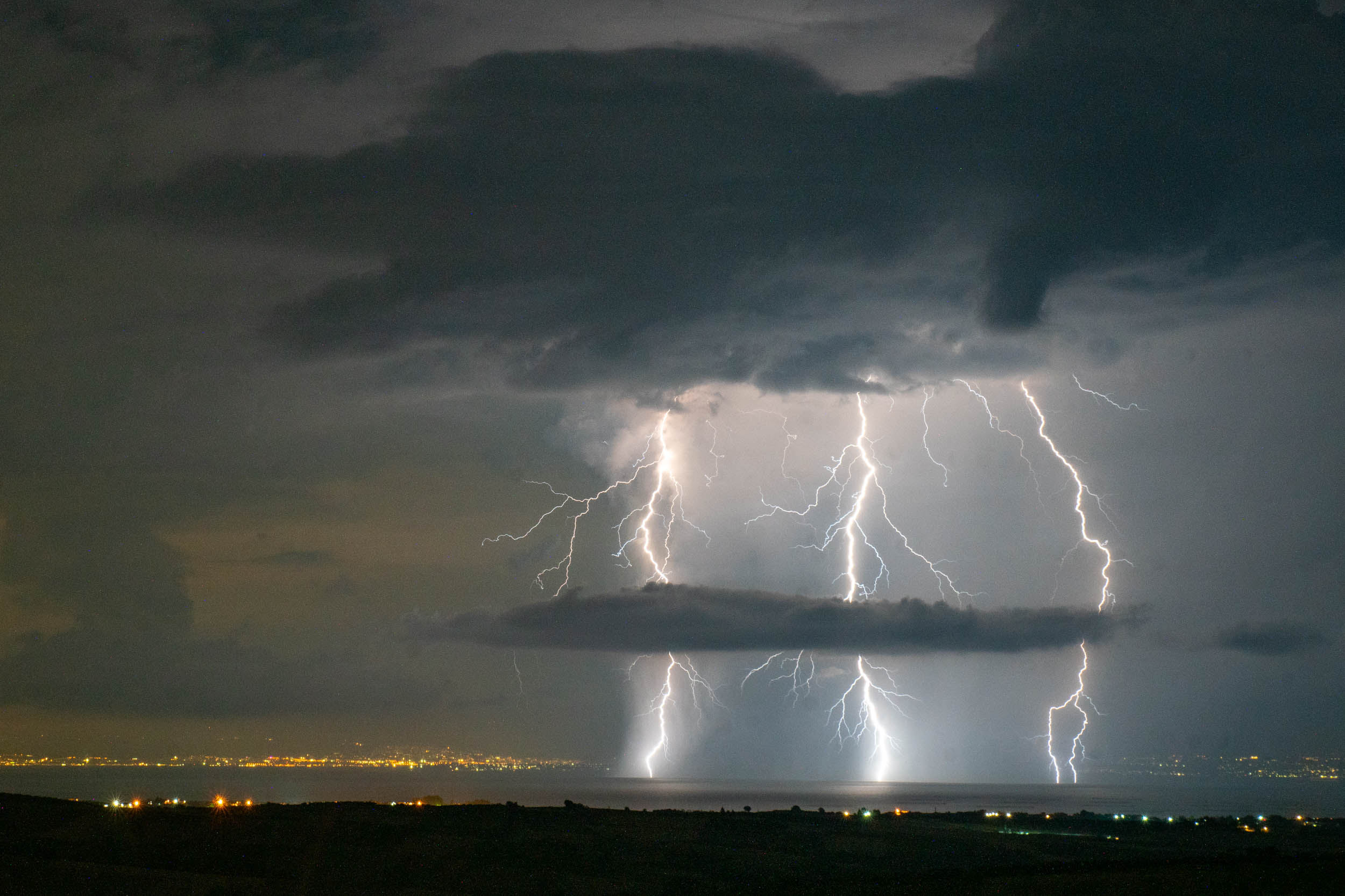 Lightning strike at night over the Aegean Sea, viewed from Alonia, Greece, facing Thessaloniki and Chalkidiki